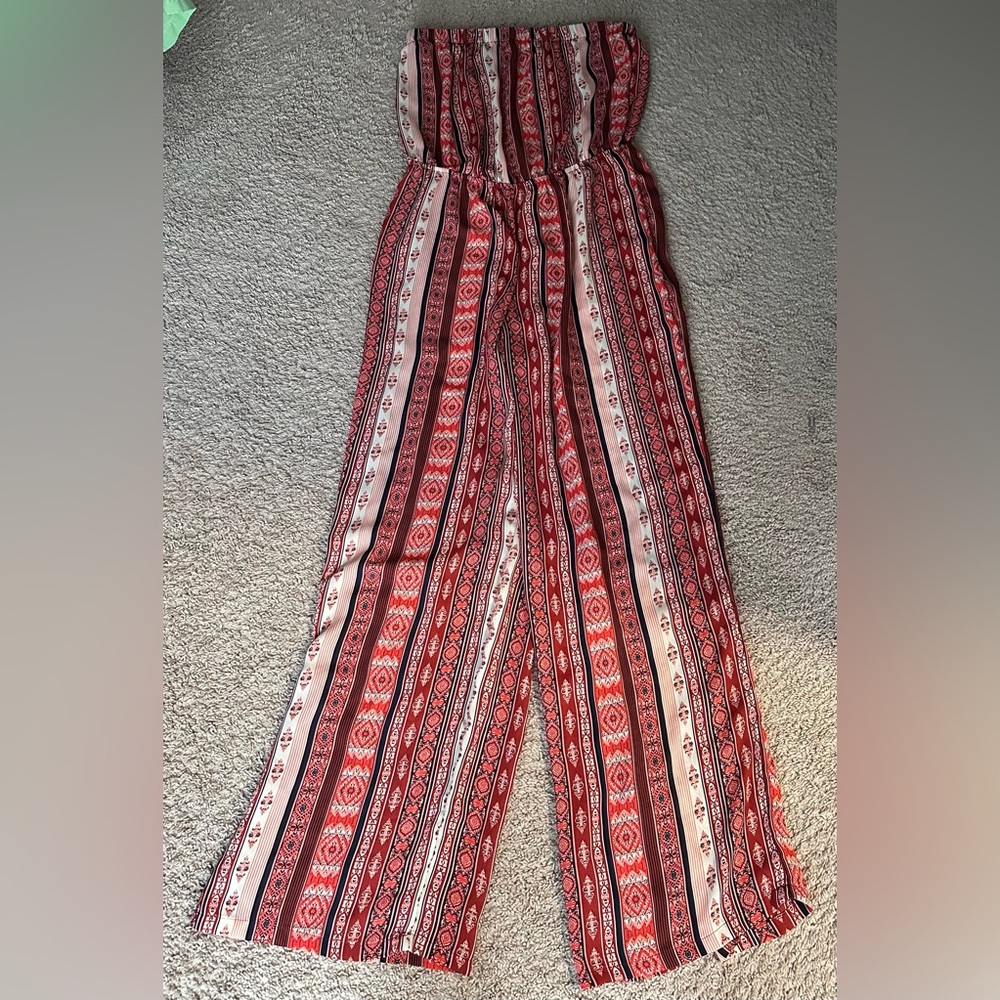 RUE 21 size LARGE Orange, cream, black & red patterned wide legged  romper
